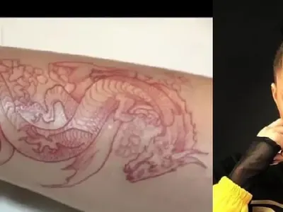 Дара си татуира дракон