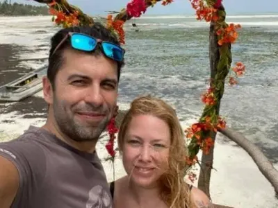 Линда вярва на мъжа си! Премиершата се среща с мистериозен мъж (Папарашка снимка)