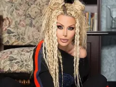 Гущерова с дрехи за 10 бона